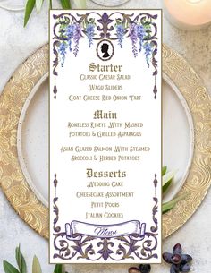 a menu card with purple flowers and greenery on the table next to some candles