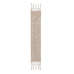 a beige rug with fringes on the bottom and one long piece of fabric hanging from it