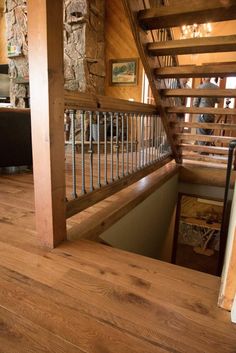 the stairs are made of wood and have metal railings