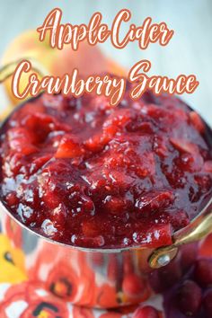 cranberry sauce in a pot with the words, apple cider cranberry sauce