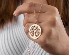 Our Tree of Life Necklace is more than simply a lovely piece of jewelry; it also serves as a potent representation of family, connection to nature, and personal development. The pendant's elaborate design features a tree with upward-facing branches and earthbound roots, signifying the harmony between heaven and earth and the interdependence of all living things. Our Tree of Life Necklace is made to last because it was expertly made using only the best materials. The chain is sturdy and adjustable to comfortably fit any neck size, and the pendant is constructed of top-notch metal. You can select the necklace's finish from three options, including rose gold, gold, and silver, depending on what best suits your particular style. * Material: Copper, Sterling Silver * Color: Silver, Gold, Rose G Nature-inspired Rose Gold Necklace, Personalized Nature-inspired Necklaces As A Gift For Her, Nature-inspired Rose Gold Jewelry Gift, Tree Of Life Necklace For Gift, Gold Rose Necklace, Necklace Family, Grandma Necklace, Mother Necklace, Anniversary Necklace