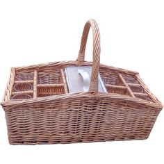 a wicker basket with an electronic charger in the bottom and two compartments on each side