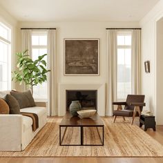 a living room filled with furniture and a fire place