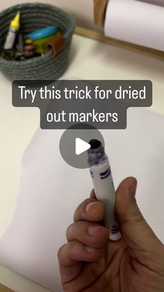 a person is holding a marker and pointing it at the camera text reads try this trick for dried out markers