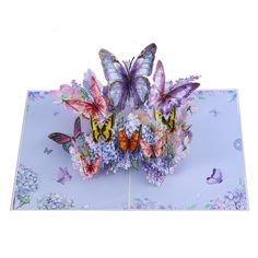 three butterflies sitting on top of each other in the middle of a blue and purple background