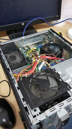 an open computer case sitting on top of a desk