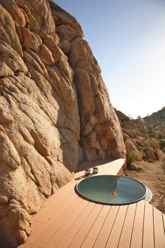 an outdoor hot tub in the middle of a desert