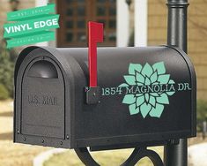 a black mailbox with a red post on it and a green sign that says,'138 wapetty drive '