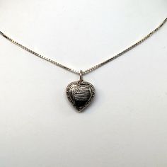 "This antiqued sterling silver, two-sided, repousse Puffy heart Charm Number 33 features an American flag framed by an heart. Marked, Sterling. Made by Brown County Silver. Vintage and in new, never worn condition. Approximately 30 years old. Small: 5/8\" high with jump ring 3/8\" wide 0.7 grams Medium: 7/8\" high with jump ring 5/8\" wide 1.4 grams *Chain sold separately See more @ https://www.etsy.com/shop/brocosi" Antique Silver Sterling Heart Pendant Jewelry, Antique Silver Sterling Silver Heart Pendant, Antique Silver Heart Pendant Sterling Silver Jewelry, Antique Silver Heart Charm Jewelry Gift, Antique Silver Heart Pendant In Sterling Silver, Antique Silver Sterling Silver Jewelry For Valentine's Day, Valentine's Day Antique Silver Sterling Silver Jewelry, Stamped 925 Heart Pendant Keepsake Jewelry, Antique Silver Heart Charm Jewelry For Valentine's Day