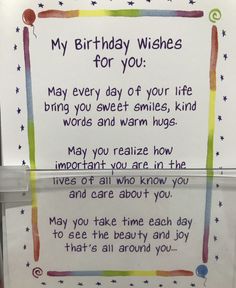 a birthday wish written on a sign in front of a refrigerator door with magnets attached to it