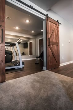 an open door leading to a home gym