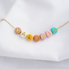 Dainty Colorful Name Necklace Alphabet Initial Necklace Custom Gift for Her Fun Summer Necklace Women Necklace Jewelry Birthday Gift Customize your necklace the way you want, add a name, motivational word, initials etc. Perfect for bridesmaids, sister, mother and daughter gifts, travel gifts, soul mates jewelry gifts etc. Made with high quality stainless steel plated chains. If you select two words, will be separated by a bead. Beads are 6mm, will be selected randomly, unless you let us know an specific initial color or colors. We offer rose gold, gold or rhodium color. P A C K A G I N G All jewelry comes in a velvet pouch. NOTE We don't recommend beaded necklaces for children under 3 years old without adult supervision as it contains small parts that can be swallowed. Trendy Personalized Beaded Necklaces For Gifts, Dainty Name Necklace With Letter Beads For Personalized Gift, Custom Name Beaded Necklace As Gift, Fun Personalized Beaded Necklaces, Playful Personalized Multicolor Beaded Necklaces, Whimsical Accessories, Mother Daughter Necklace, Daughter Jewelry, Daughter Necklace