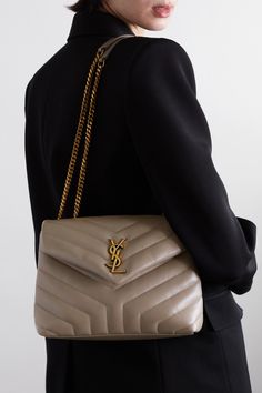 Originally created by graphic designer Adolphe Jean-Marie Mouron in 1962, SAINT LAURENT's iconic 'YSL' monogram continues to be recognized as an assurance of quality and luxury. This quilted 'Loulou' bag has been made in Italy from smooth leather detailed with signature chevron stitching. Though compact, it has a well-organized interior with two compartments, a zipped pocket and three card slots. Ysl Loulou Bag, Ysl Logo, Bag Dark, Purse Brands, Dior Handbags, Small Quilts, Saint Laurent Bag, Quilted Bag, Womens Purses