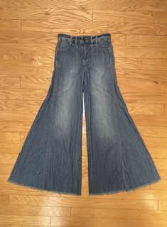 Amazing pair of vintage 1990s Free People elephant ear bell bottom denim jeans. These jeans are sooooo flattering!! They look great all Four Seasons but are especially cute as Summer jeans / Festival jeans.  Medium wash with whiskering. Front & back pockets. Belt loops. Raw hems.  Very bohemian, unique pair of jeans! These will be your go-to jeans because they look soooo good and they're soooo comfy.  Just brace yourself for a zillion complements and a zillion "I LOVE your jeans! Where did you get them?!" questions! :)  Buttons & zipper closure.  Last listing pix are is similar style Free People jeans shared for styling inspo.  💥Condition: Excellent vintage condition.   💥Approximate Measurements (lying flat): Waist Width: 26" Inseam:  Please be sure the approximate measurements are a goo Retro Wide Leg Bottoms With Frayed Hem, Retro Wide-leg Bottoms With Frayed Hem, Hippie Wide Leg Jeans For Fall, Vintage Wide Leg Bottoms With Frayed Hem, Vintage Wide-leg Bottoms With Frayed Hem, Medium Wash Cotton Flare Pants, Medium Wash Cotton Flare Jeans, Medium Wash Cotton Flares, Dark Wash Full Length Cotton Flares