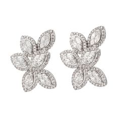 Stunning illusion set diamond cluster earrings diamonds, by Alexander Beverly Hills.  288 round brilliant, marques, and princess cut diamonds, 5.53 carats total. Approximately G/H color and VS2/SI1 clarity. 10.76 grams, 18-karat white gold, 1.25 inches long. Accommodated with an up-to-date appraisal by a GIA G.G. once purchased, upon request. Please contact us with any questions. Luxury Timeless Diamond White Cluster Earrings, Diamond White Cluster Diamond Bridal Earrings, Bridal Marquise Diamond Earrings With Brilliant Cut, Marquise Cut Diamond Cluster Earrings For Formal Events, Marquise Cut Diamond Cluster Earrings For Formal Occasions, Diamond White Cluster Bridal Earrings, Wedding Diamond White Earrings With Baguette Diamonds, Wedding Diamond Earrings With Baguette Diamonds, Diamond White Marquise Diamond Bridal Earrings