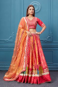 Buy this Red embroidered bandhej lehenga with a contrasting orange dupatta online in the USA. Featuring embroidered blouse with 3/4th sleeves blouse The Lehenga comes with a look royal at weddings and festive occasions in exquisite designer sarees, gowns, lehngas, Anarkali, and suits Pure Elegance Indian saree stores in the USA. Bandhej Lehenga, Orange Dupatta, Printed Lehenga, Pure Elegance, Fashion Journals, Sleeves Blouse, Traditional Fabric, Indian Saree, Designer Sarees