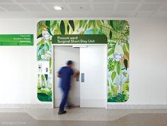 a man is walking through an open door at the entrance to a tropical short stay unit