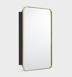 a mirror with a black frame and gold trim around the edges, on a white background