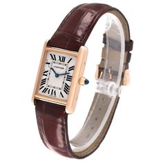 Cartier Tank Louis Rose Gold Mechanical Mens Watch WGTA0011. Manual winding movement. 18k rose gold case 25 mm x 33 mm. Circular grained crown set with a blue sapphire cabochon. . Scratch resistant sapphire crystal. Silvered guilloche dial with black Roman numeral hour markers and an inner minute track. Sword shaped blued hands. Secret Cartier signature at VII. Brown leather strap with 18K rose gold tang buckle. Classic Cartier Watch Band For Formal Occasions, Classic Cartier Rectangular Watches, Formal Cartier Watch Band With Rectangular Dial, Cartier Rectangular Business Watch Accessories, Cartier Yellow Gold Watch Accessories, Formal Cartier Watch Accessories, Rectangular Shape, Cartier Yellow Gold Watch Accessories For Business, Cartier Rectangular Watch Accessories For Formal Occasions, Formal Rectangular Cartier Watch Accessories