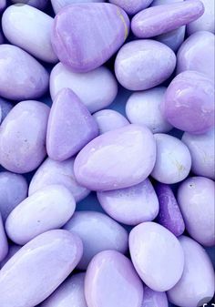 purple and white rocks are piled together