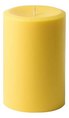 a yellow candle is shown on a white background