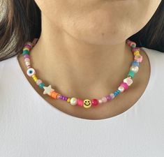 14' Smiley face necklace, Happy Face pearl choker, trendy summer necklaces, colored beaded necklaces Item details: Includes a colorful combination of beads from Czech beads, plastic beads and pearls just like a wheel of fortune you will get an amazing combination of most precious beads  Processing time (the time I need to prepare an order for shipping): 1-2 business days. Estimated shipping times: Actual delivery time will depend on the shipping method you choose at checkout.  The color intensit Smiley Face Necklace, Summer Necklaces, Rave Accessories, Face Necklace, Precious Beads, Mass Communication, Wheel Of Fortune, Summer Necklace, Pretty Earrings