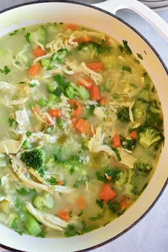 a pot filled with chicken and broccoli soup