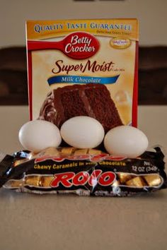 chocolate cake mix and eggs in front of an egg carton on a counter top