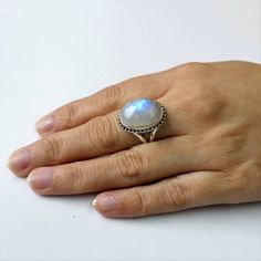 AAA Rainbow Moonstone ring, Real Sterling Silver ring, cocktail ring, alternative engagement ring, avant garde, birthstone ring, Rainbow Moonstone jewelleryDescription:Be assured that the product you order is MADE JUST FOR YOU and is not a mass produced item.The gemstone is a OVAL shaped  AAA RAINBOW MOONSTONEGEMSTONE SIZE- 18*13 mm. You have an option to choose a gem for yourself from a set of the stones. Please ask. The rest of the ring is made from 925 STERLING SILVER i.e 92.5% pure silver. A Handmade Moonstone Ring With Round Stone, Round Moonstone Ring With Natural Stones, Fine Jewelry Moonstone Ring With Natural Stones, Handmade Round Moonstone Ring, Bohemian Moonstone Birthstone Ring, Round Moonstone Ring, Handmade Open Moonstone Ring In Fine Jewelry Style, Mystical Style Moonstone Ring With Natural Stones, Handmade Moonstone Promise Ring With Round Stone