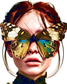 a woman with butterfly wings on her face