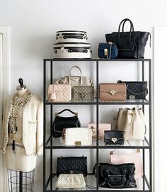 a rack with purses and handbags on it