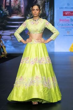 Lime green panelled lehenga featuring resham embroidered floral motifs, embellished by beads, sequins, pearls along with attached can can. Comes with embroidered padded crop top in cut-out silhouette. - Aza Fashions Green Set With Floral Embroidery And Traditional Drape, Fitted Green Lehenga With Cutdana, Green Sharara With Floral Embroidery For Navratri, Green Floral Embroidered Sharara For Navratri, Green Floral Embroidery Sets For Diwali, Green Raw Silk Anarkali Set With Floral Embroidery, Reception Green Sharara With Floral Embroidery, Designer Green Lehenga With Floral Embroidery, Green Raw Silk Sets With Floral Embroidery