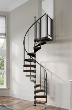 a spiral staircase in an empty room