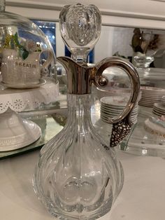 a clear glass vase sitting on top of a table