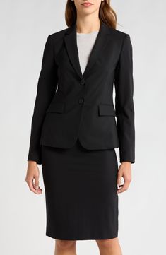 Opt for a classic professional look in this stretch wool suiting jacket. \nFit: this style fits true to size. \n- Notch collar\n- Long sleeves\n- Front 2-button closure\n- 2 front flap pockets\n- Approx. 22" length (size 2)\n- Imported Model's stats for sizing:. Height: 5'9". Bust: 33". Waist: 24". Hips: 34" Model is wearing a size 2. Dry clean Shell: 96% virgin wool, 4% elastane Lining: 100% polyester Concert Looks, Classic Suit, Preppy Look, Notch Collar, Sweaters And Leggings, Professional Look, Comfortable Dress, Black Fits