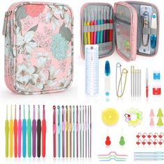 an assortment of pens, markers, and scissors in a pink case with flowers on it