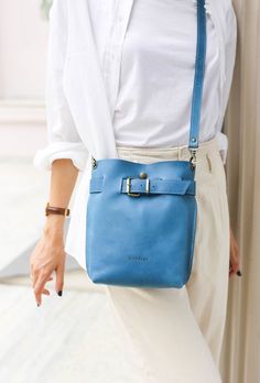 Gorgeous Blue leather bag for women, which is ideal for travel and makes a perfect Leather crossbody / Backpack purse. Handmade from the softest leather to last a lifetime. True combination of style and comfort. 🌟Convertible leather bag: You can customize your purse to be Convertible and serve as three Bags in one - a Backpack, Crossbody bag and a Shoulder Bag. * Simple, Elegant * High Quality, Soft natural leather . * Safe - Front buckle and button snap closing mechanism. * Interior pocket wit Travel Bucket Bag With Leather Strap, Daily Use Leather Crossbody Backpack, Daily Use Crossbody Bucket Bag With Leather Strap, Leather Strap Bucket Bag Tote For Travel, Daily Use Leather Strap Crossbody Bucket Bag, Leather Strap Crossbody Bucket Bag For Daily Use, Travel Shoulder Bag With Leather Strap, Travel Bucket Bag With Leather Strap Satchel, Blue Leather Bucket Bag For Everyday Use