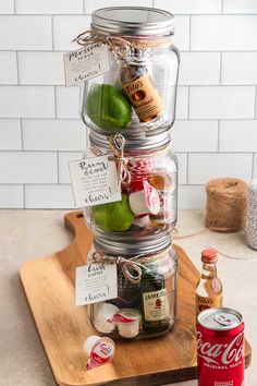 three mason jars stacked on top of each other and labeled with different types of condiments