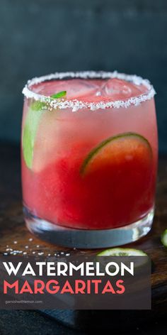 the watermelon margarita is garnished with lime