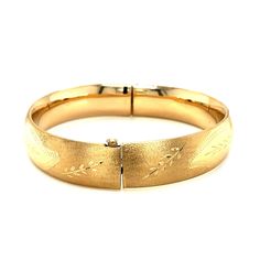 A classic floral carved high polish bangle crafted in 14k yellow gold with a hidden clasp. Product Details: Bangle Information : Metal : 14K Yellow Gold Clasp : Hidden Clasp Width : 0.53 in Approximate Weight: Size Weight 7'' 19.2 grams 8'' 20.5 grams Hinged Yellow Gold Round Cuff Bracelet, 14k Yellow Gold Etched Bracelets, Etched 14k Yellow Gold Bracelets, 14k Yellow Gold Hinged Bracelet, Classic Hinged Yellow Gold Bangle, Classic Etched Gold Bracelet For Formal Occasions, Formal Etched Gold Bangle Bracelet, Elegant Etched Bangle For Formal Occasions, Elegant Etched Yellow Gold Bangle