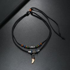 Material: Leather Color: Coffee Color, Black Fashion Element: Bone Style: Ethnic Style Retro Elements, Layered Crosses, Element Necklace, Tooth Necklace, Braided Necklace, Dog Teeth, Mens Pendant, Men's Necklace, Coffee Colour