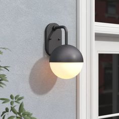 an outdoor light mounted on the side of a building