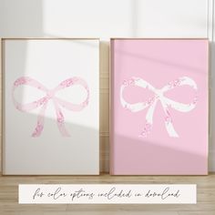 two pink and white framed pictures with bows on them