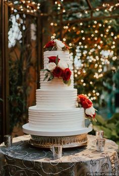 a white wedding cake sitting on top of a table