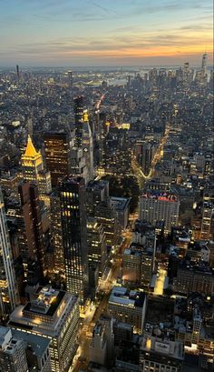 an aerial view of new york city at night from the top of the empire building