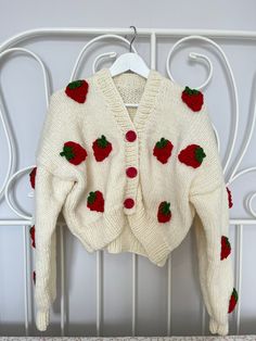 The Strawberry Cardigan and Knit Crop Jacket for Women are versatile and elegant pieces that can add style to any outfit. These cardigans feature intricate Strawberry and comfortable knit construction, perfect for layering over dresses or pairing with high-waisted bottoms for a trendy look. Cardigan Size Guide : Country/Size ... S/M  M/L  L/XL USA & CAN : .... 2 - 6  6 - 10  10 - 14 EU :  34-38 .... 38-42  42-46 UK & AUS :  6-10  10-14  14-18 Shipping Time Since our products are handmade, they are made to order. The shipping time of your orders is 2-5 days. Caring Tips -Please gentle wash in washing machine or We recommend Professional dry cleaners or hand wash. -Store your Knitso knitwear by folding them instead of hanging them. Knitted Long Sleeve Sweater Gift, Knitted Long Sleeve Sweater As Gift, Handmade Cream Cardigan For Winter, Knit Crop, Crop Jacket, Crochet Sweater, Jumpers And Cardigans, Cardigans For Women, Knit Cardigan