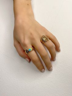 Two different handmade rings with base in gold color. Both of them have unique shape and different designs. The first one is a gold signet ring with a turquoise enamel stone, and the second one is a gold evil eye ring. Both of them are slightly adjustable. In Christina Christi Jewels store you can see a lot of designs in Women's Rings. You can have them in 2-4 Days with DHL EXPRESS SHIPPING MATERIALS - Gold Plated 24k Pewter. DIMENSIONS - Rings Diameter is 17mm (0.67'') - US 7 - Slightly Adjusta Handmade Gold Turquoise Ring For Anniversary, Gold Enamel Stackable Rings As Gift, Gold Turquoise Open Ring As A Gift, Heirloom Style Gold Turquoise Ring As Gift, Adjustable Gold Turquoise Ring In Fine Jewelry Style, Enamel Rings With Gemstone For Gift, Gold Ring With Unique Variations, Handmade Gold Oval Stackable Rings, Unique Gold Enamel Ring For Anniversary