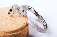 Panther w/precision Machine set Pave Zirconite Cubic Zirconia hinged Bangle Bracelet. Made of fine Brass precision workmanship w/attention to the smallest detail. Workmanship signature is reserved only for that perfect fine jewelry Look results. Notice the Gallery perfect Finish beneath the Ring. Bangle fits Small to Regular size Wrist. Ring pictured, but not included. Leopard Head, Art Deco Bracelet, Fashion Unique, Bangles Style, Ring Pictures, Copper Bracelet, Statement Bracelet, Hinged Bangle, Cuff Bangles