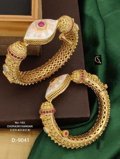 Description :- Gold plated Rajwadi openable Kada Bangle/Indian Kada/Wedding Jewelry/Kada/Punjabi Jewelry/Indian Wedding/Bollywood bangles Gift yourself a royal look with this perfectly crafted necklace set from Manalisstudio. Crafted with high quality stones and pearls, it is impressive in design. The green enamel artwork adds perfect texture to the design. Perfect for weddings and festivities, this antique Chuda set should be put on with your favorite sari or lehenga. 100% Satisfaction. Long La Traditional Ceremonial Bangle Jewelry, Bollywood Style Bangle For Diwali Wedding, Ceremonial White Bracelets With Intricate Design, Bollywood Style Chandbalis With Intricate Design For Ceremonial Occasions, Bollywood Style Chandbalis With Intricate Design For Ceremonies, Ceremonial White Bracelet With Intricate Design, Bollywood Bangle For Wedding And Diwali, Bollywood Style Wedding Bangle For Diwali, Kundan Cutdana Bangle For Wedding