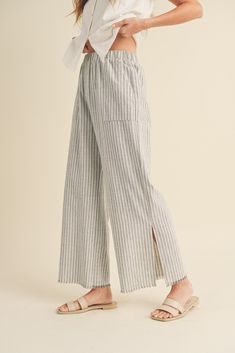 DescriptionThe Seaside Striped Linen Pants feature: Raw edge Side pockets Side slits Wide leg Elastic waistband FitRelaxed, true to size MaterialLinen / Cotton Pull-on Trousers For Loungewear, Wide Leg Pants With Pockets And Straight Hem, Wide Leg Bottoms With Elastic Waistband For Daywear, Elastic Waistband Bottoms For Daywear, Daywear Wide Leg Pull-on Bottoms, Wide Leg Bottoms With Pull-on Style For Daywear, Wide Leg Pull-on Bottoms For Daywear, Loungewear Pants With Pockets And Straight Hem, Straight Hem Pants With Pockets For Loungewear